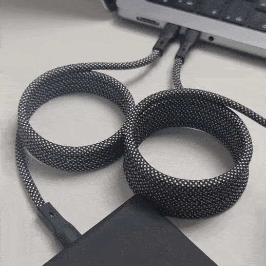 USB C magnetic cable charge cable automatic roll up plugged into laptop